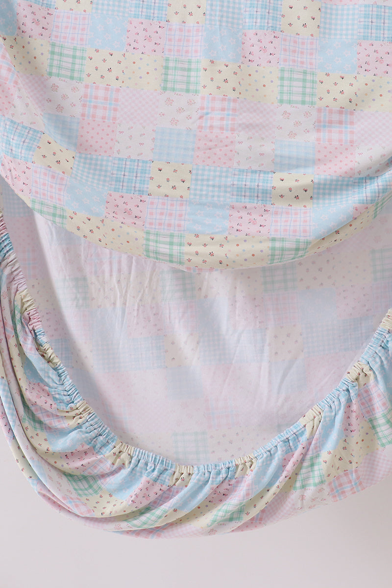 Pink floral checkered bamboo crib sheet